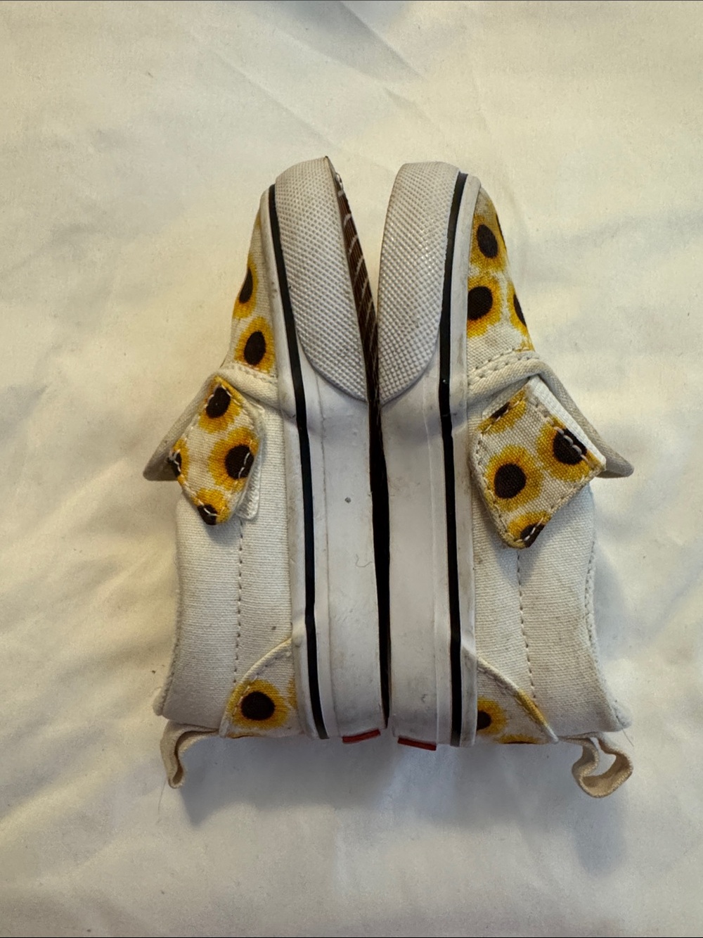 Vans Kids White Canvas Slip-Ons with Yellow Sunflower Accents